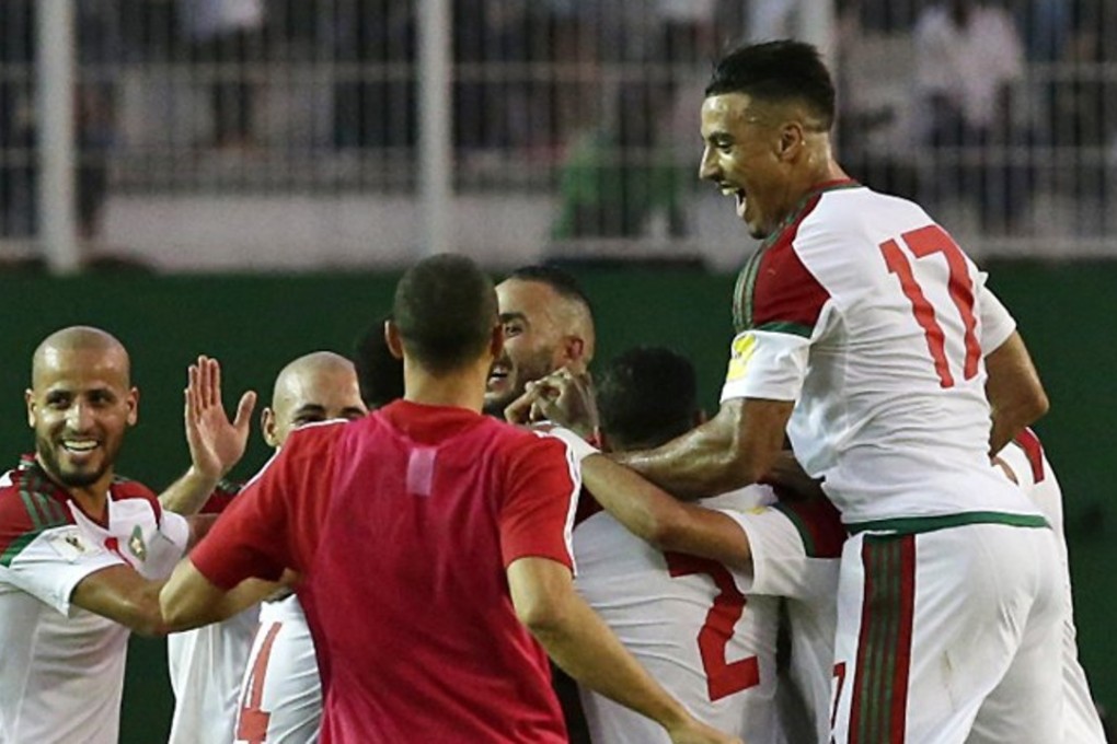Morocco players celebrate reaching the 2018 World Cup. Photo: EPA