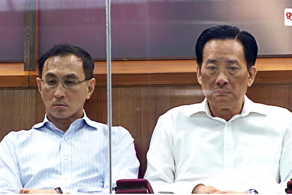 Desmond Kuek and Seah Moon Ming listen to the parliamentary hearing in the public gallery. Image: YouTube