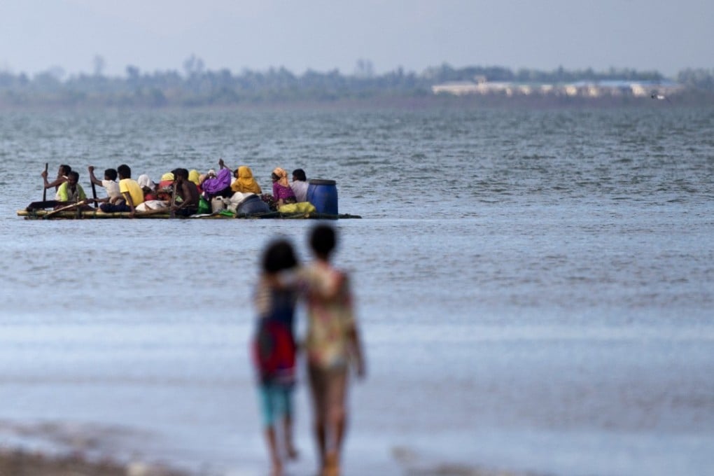 Groups of Rohingya Muslims travel on a rafts made from plastic containers across the Naf river from Myanmar into Bangladesh, escaping a military crackdown in Rakhine state. Photo: AP
