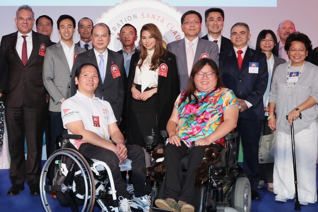 Donors, beneficiaries and organisers of Operation Santa Claus 2017, with CEO of the South China Morning Post Gary Liu (eighth from left), Chief Secretary Matthew Cheung (pictured to the right of Liu) and Leung Ka-Wing (back row, third from right) head of broadcasting at RTHK. Photo: Felix Wong