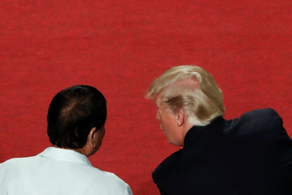 US President Donald Trump speaks with President of the Philippines Rodrigo Duterte at the opening ceremony of the Asean Summit in Manila. Photo: Reuters