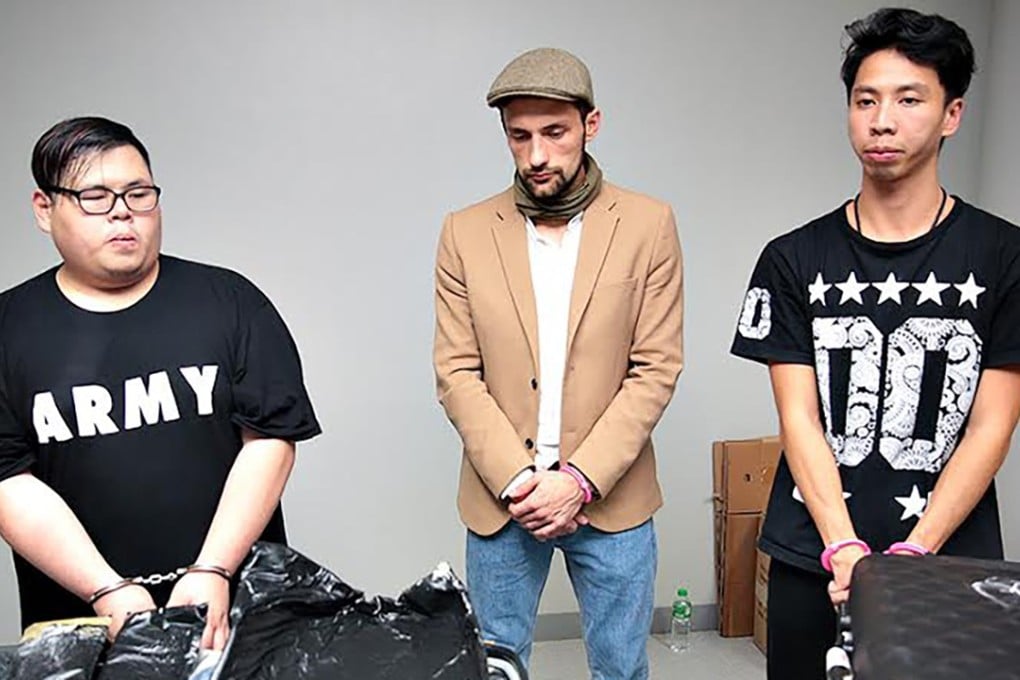 Russian Kirdyushkin Yuri (centre) and Hong Kong nationals Chan Ka-wai and Evan Pau Ho-man, were arrested at the Ninoy Aquino International Airport, on October 5, 2016. File photo: MIAA