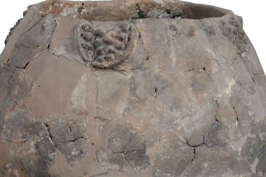 In this image released by the Georgian National Museum shows a neolithic jar from Khramis Didi-Gora, Georgia. Pottery fragments from 8,000-year-old jars unearthed near the Georgian capital, Tbilisi, are the earliest evidence of winemaking in the Near East, bringing the tradition back almost 1,000 years earlier than thought, researchers said. Photo: AFP