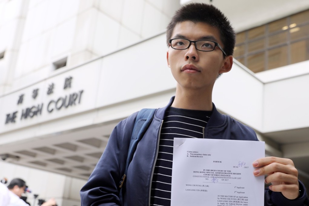 Joshua Wong wants to change laws that prevent people sentenced to jail from running for office. Photo: Sam Tsang