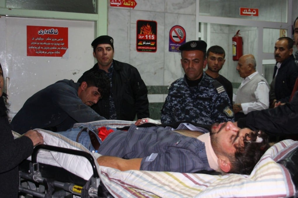 An earthquake victim is aided at Sulaimaniyah Hospital in Sulaimaniyah, Iraq. Photo: AFP