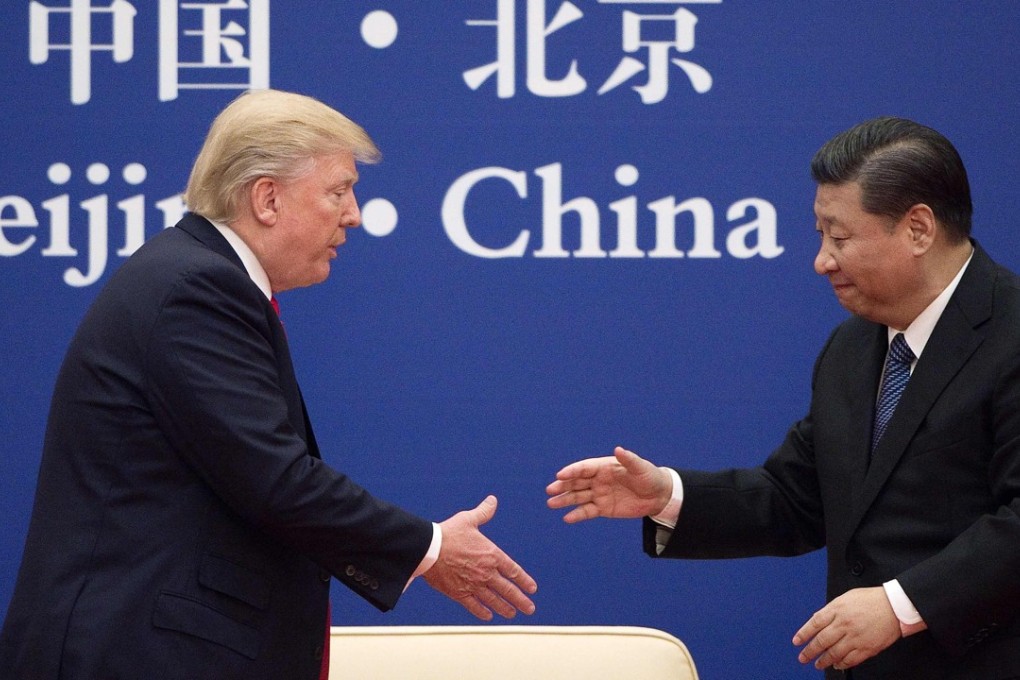 President Xi Jinping shakes hands with his US counterpart during a business leaders event at the Great Hall of the People in Beijing on November 9. Photo: AFP