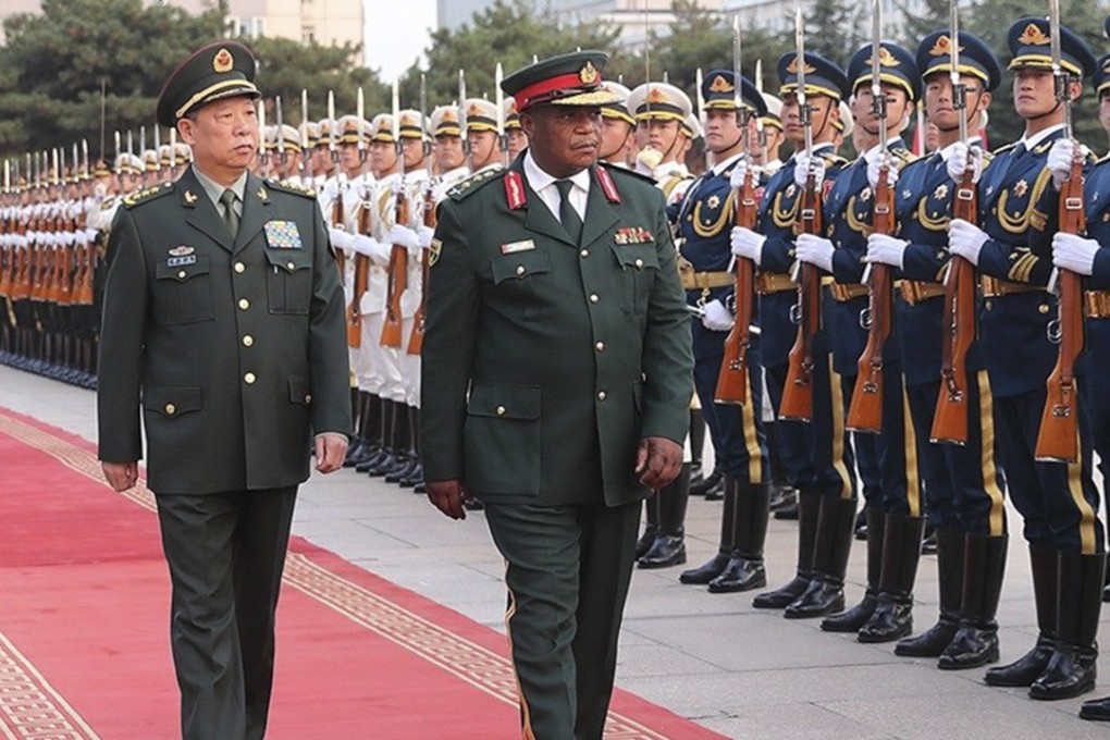 General Li Zuocheng (left), chief of the Joint Staff Department under China’s Central Military Commission, helps welcome General Constantine Guveya Chiwenga, commander of the Zimbabwe Defence Forces, to Beijing on November 8. Photo: Mod.gov.cn