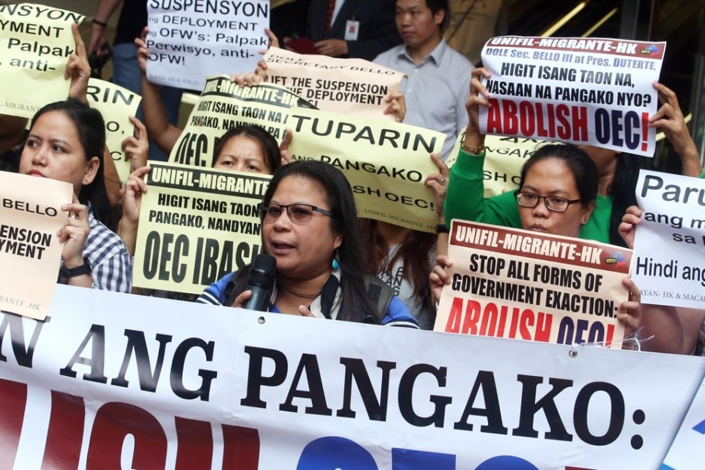Members of a union for Filipino domestic helpers in Hong Kong hold a protest outside the consulate at United Centre Building. Photo: David Wong