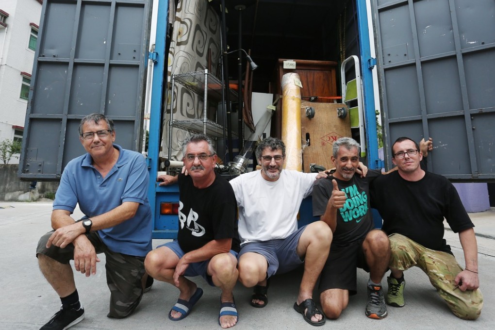 (From left) John Silva, Afonso Heaminio Machado Andorinha, Valdemar Batalha Da Cruz, Louis Mendez and Jorge Barros from Remar Association with their Mitsubishi truck. Photo: Jonathan Wong