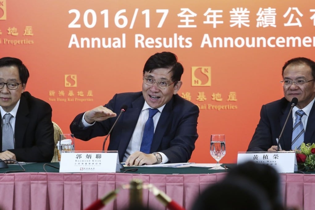 Raymond Kwok Ping-luen, centre, chairman and managing director of Sun Hung Kai Properties. The Kwok family is Asia’s third richest, according to the latest Forbes ranking. Photo: Jonathan Wong