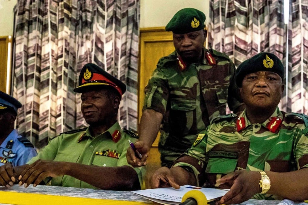 Zimbabwe Army General Constantino Chiwenga (right) and Valerio Sibanda Commander of the Zimbabwe National Army (second left) addressing the media on Monday, November 13, 2017 in Harare. Photo: AFP