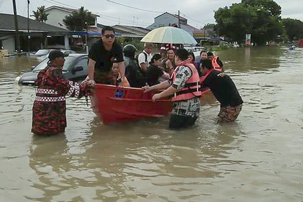 Flood victims in Georgetown, Penang. Photo: EPA