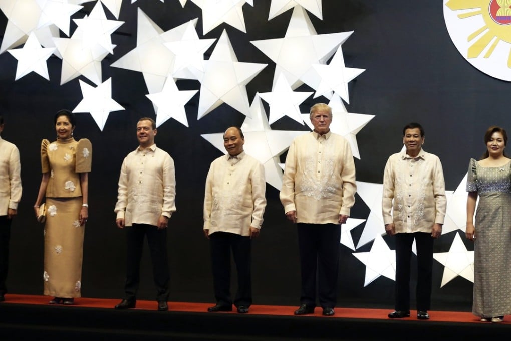 Leaders and their partners at the Asean dinner in Manila. The men all wore the barong tagalog, considered formal wear in the Philippines. Photo: EPA-EFE/Pool