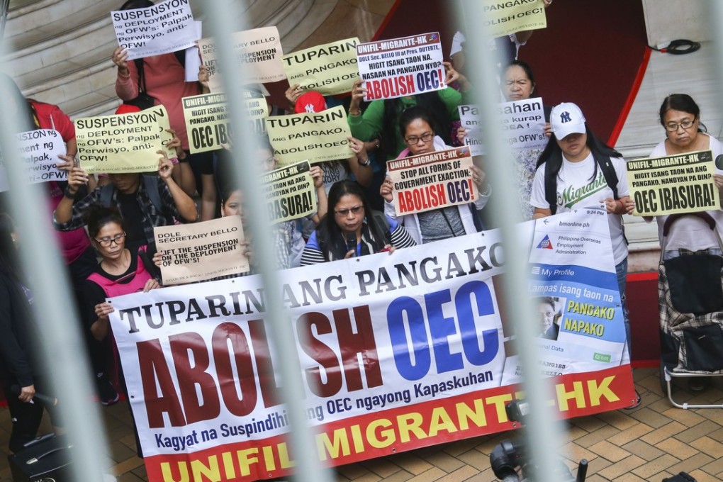 Filipinos in Hong Kong hold a short protest outside the United Centre Building in Admiralty. Photo: David Wong