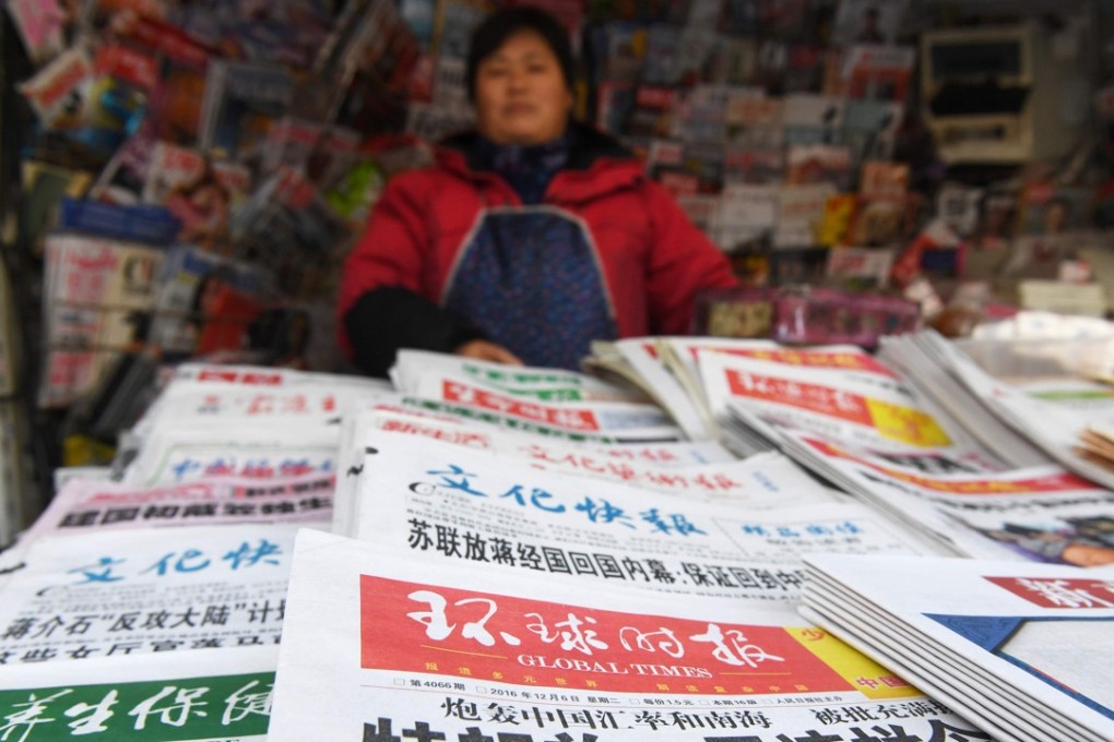 A file picture of a vendor selling newspapers in Beijing. All areas of the media in China are state-controlled or face routine oversight from government censors. Photo: Agence France-Presse