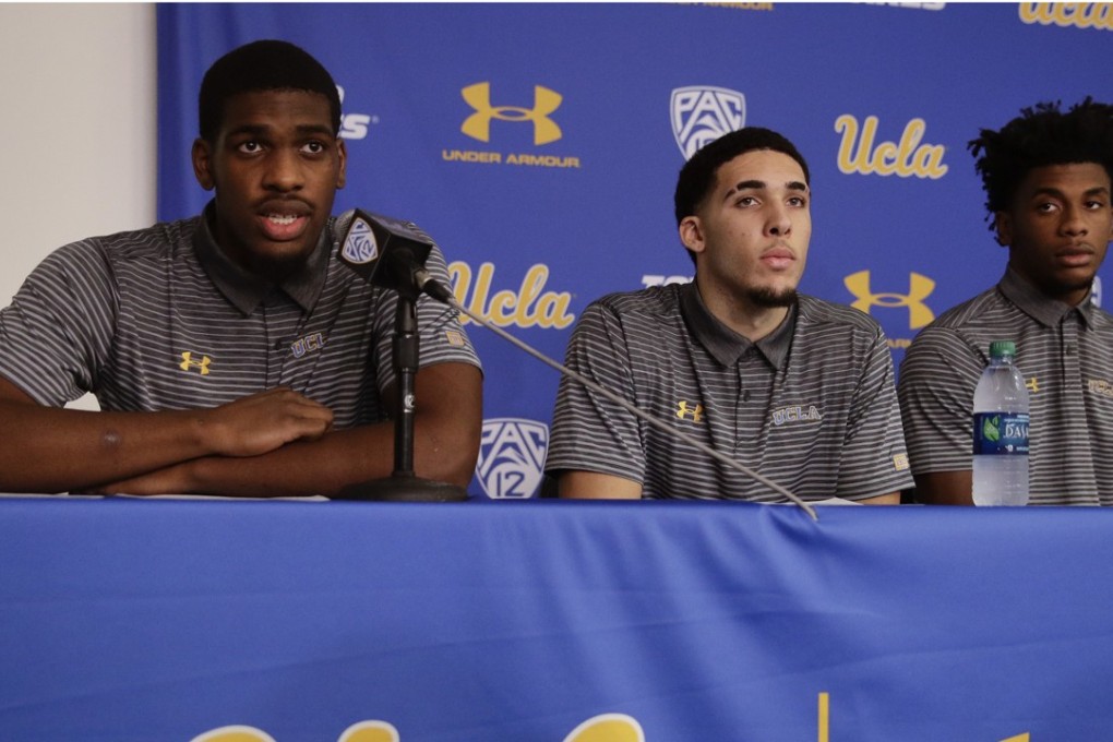 UCLA basketball player Cody Riley (L) reads his statement joined by teammates LiAngelo Ball (C) and Jalen Hill during a news conference at UCLA. Photo: AP
