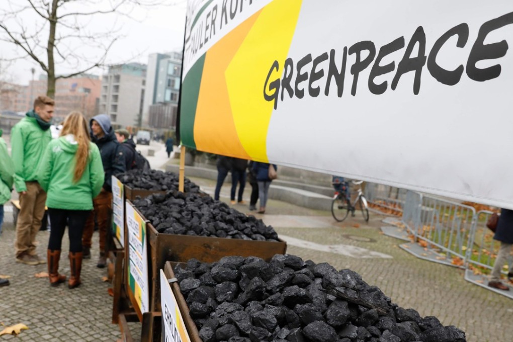 Members of Greenpeace demonstrate against the use of coal. Photo: AFP