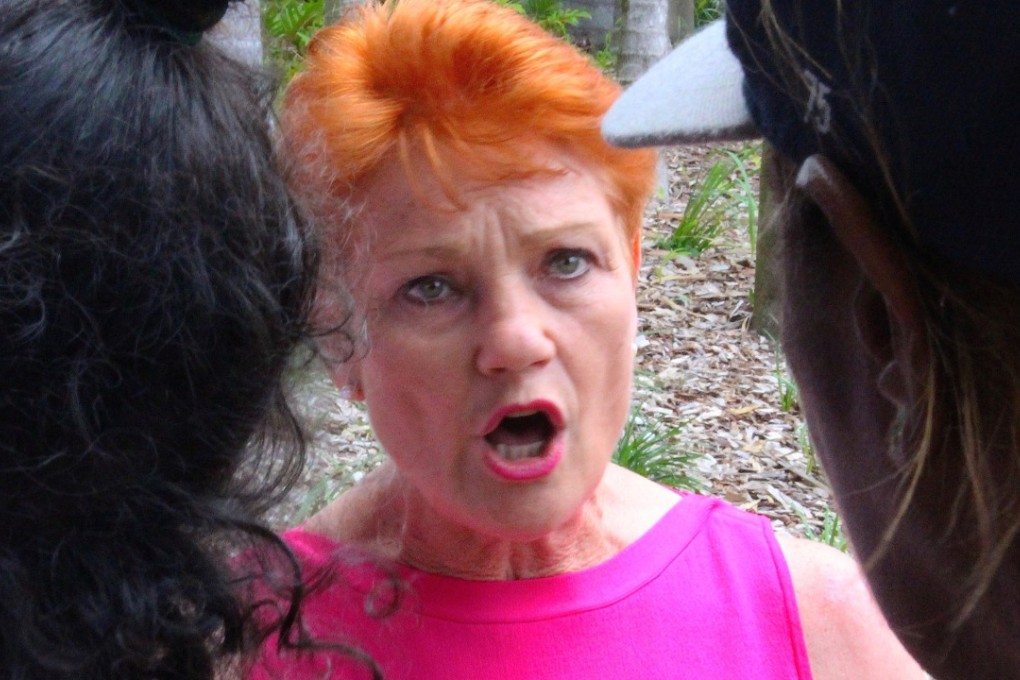 Australian senator Pauline Hanson speaks to local Aboriginal people in the northern Australian town of Rockhampton. Photo: Reuters