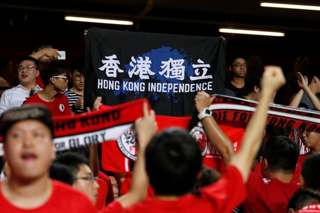 Hong Kong fans turn their backs as the Chinese national anthem plays at an AFC Asian Cup qualifier in October. Picture: Reuters