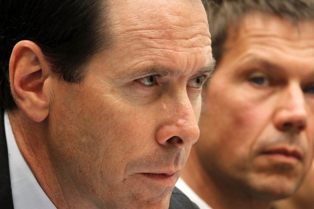 Chairman, CEO and president of AT&T Randall Stephenson (L). Photo: Alex Wong/Getty Images/AFP