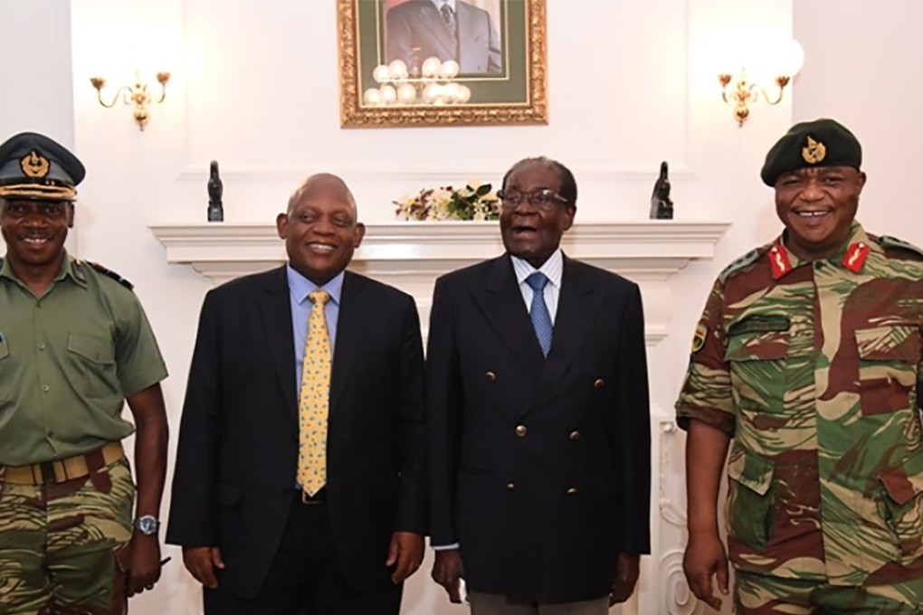 Zimbabwe President Robert Mugabe poses alongside Zimbabwe Defence Forces Commander General Constantino Chiwenga and South African envoys at State House in Harare. Photo: AFP