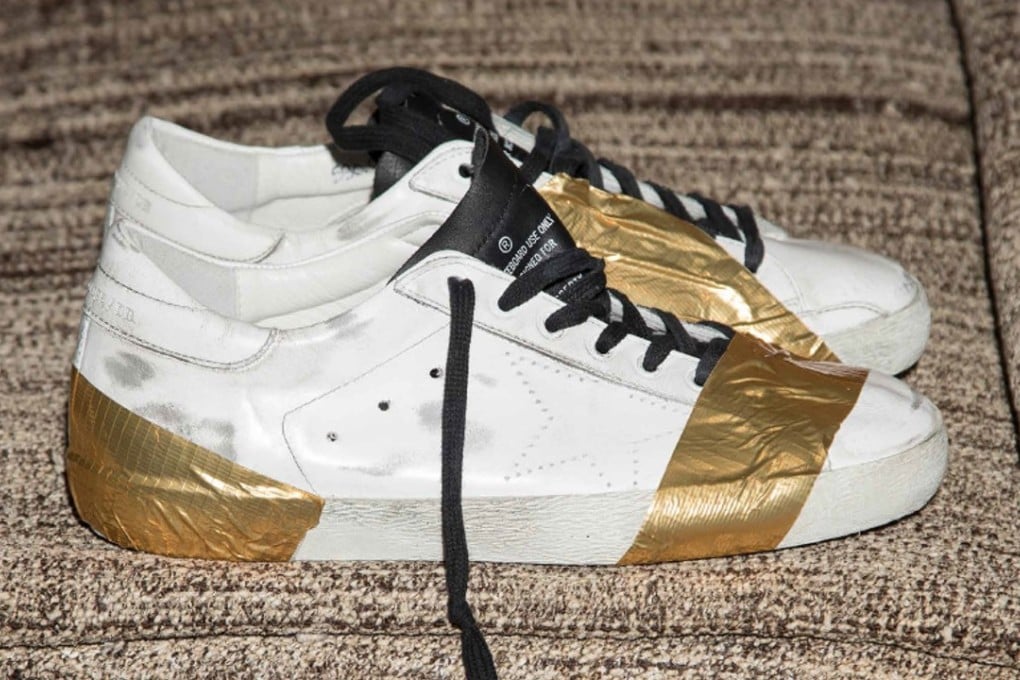 A pair of vintage-looking sneakers featuring golden tape from Golden Goose Deluxe’s autumn-winter 2017 collection.