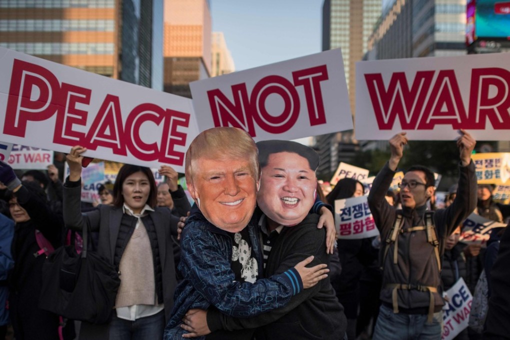 Demonstrators dressed as North Korean leader Kim Jong-un (right) and US President Donald Trump (left) embrace during a peace rally in Seoul ahead of Trump’s two-week Asian tour. Photo: Agence France-Presse