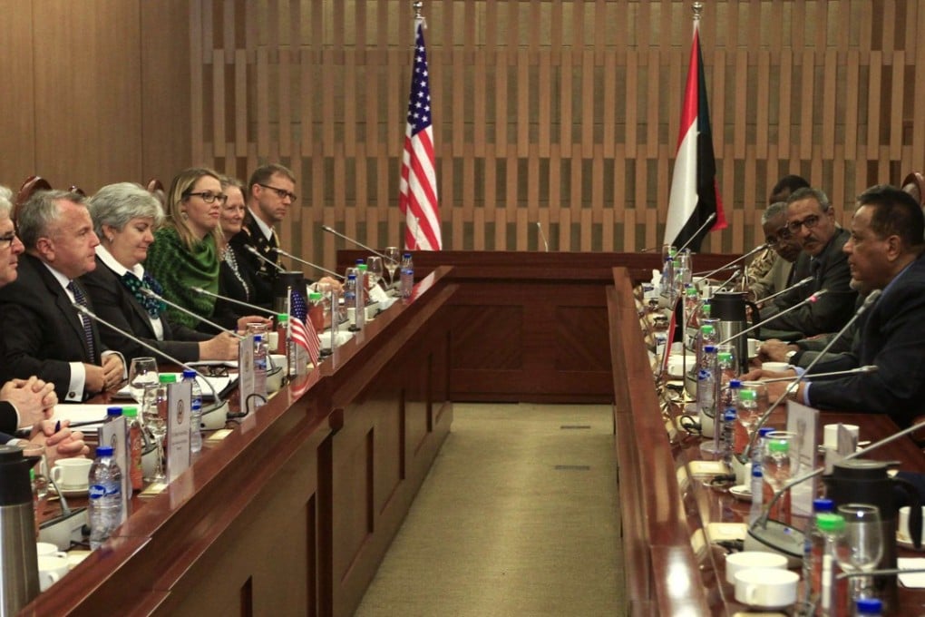 US Deputy Secretary of State John Sullivan (3rd-L) meets with Sudanese Foreign Minister Ibrahim Ghandour (4th-R) at the foreign ministry headquarters in the capital Khartoum on November 16, 2017. Sullivan is the highest ranking official from US President Donald Trump's administration to visit Khartoum since Washington lifted its embargo on October 12, he began his two-day visit aimed at discussing a range of issues, including human rights and religious freedom in the African country. / AFP PHOTO / Ebrahim Hamid