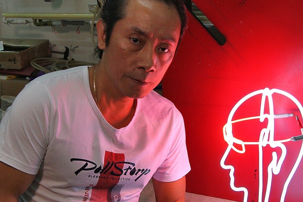 Wu Chi-kai, one of the few neon light makers left in Hong Kong, at his workshop in the Kingswin Industrial Building in Kwai Chung. Photo: Roy Issa