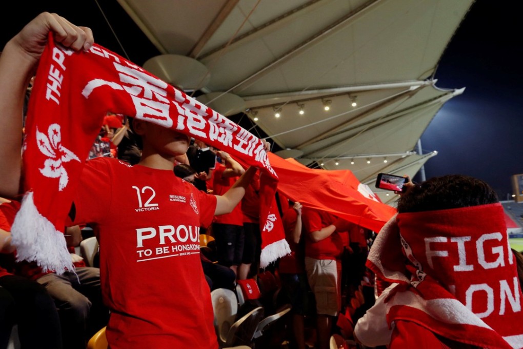 People covering their faces and booing as the Chinese national anthem played at a friendly soccer match between Hong Kong and Bahrain last week. Photo: Reuters