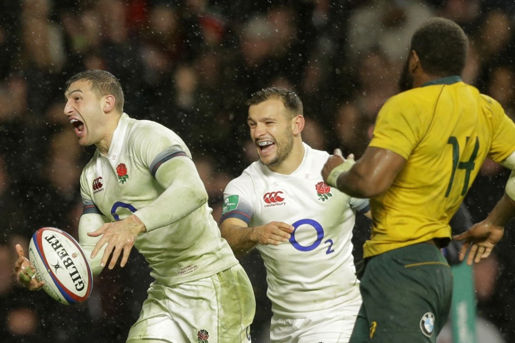 England’s Jonny May celebrates after scoring England’s third try against Australia at Twickenham. Photo: AP