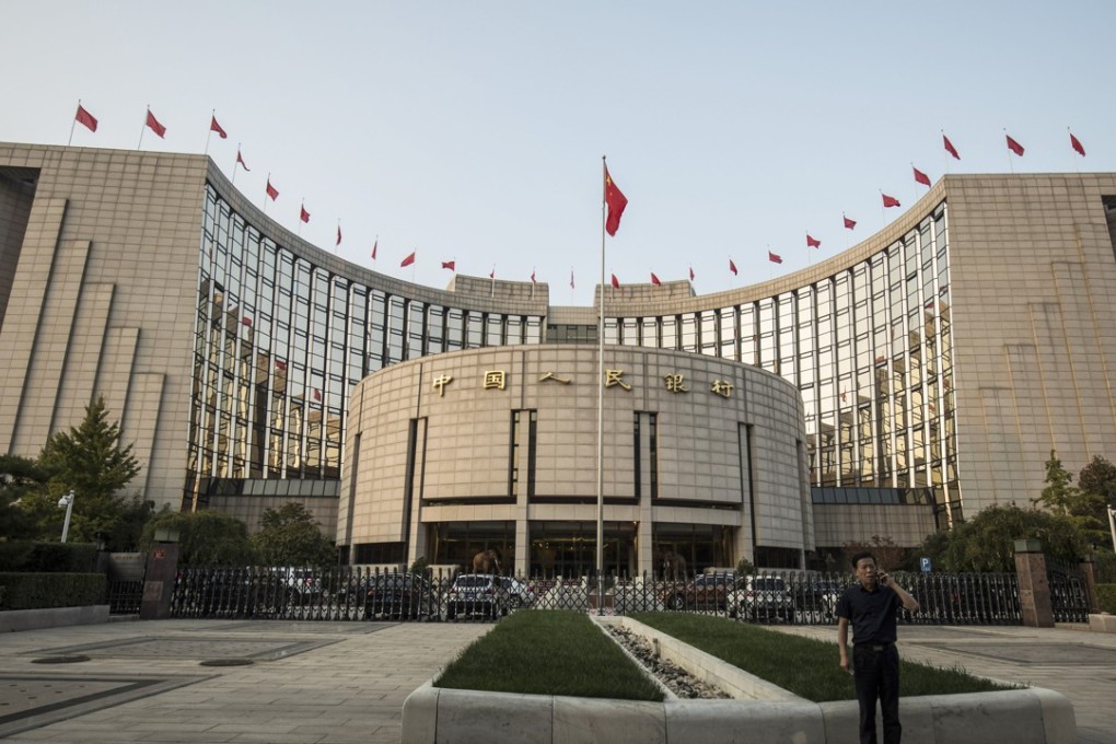 Beijing’s economic adviser Huang Qifan has outlined another way in which they have become an economic curse that has allowed central bank to release too much cash into the economy. Photo: Bloomberg
