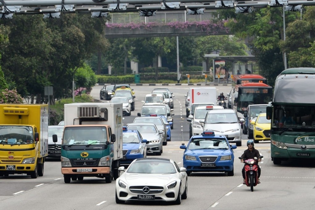 In the battle against the car, space-starved Singapore has deployed congestion charges, massive spending on public transport, and a licence fee that bumps the cost of an average vehicle to over US$80,000. Photo: AFP