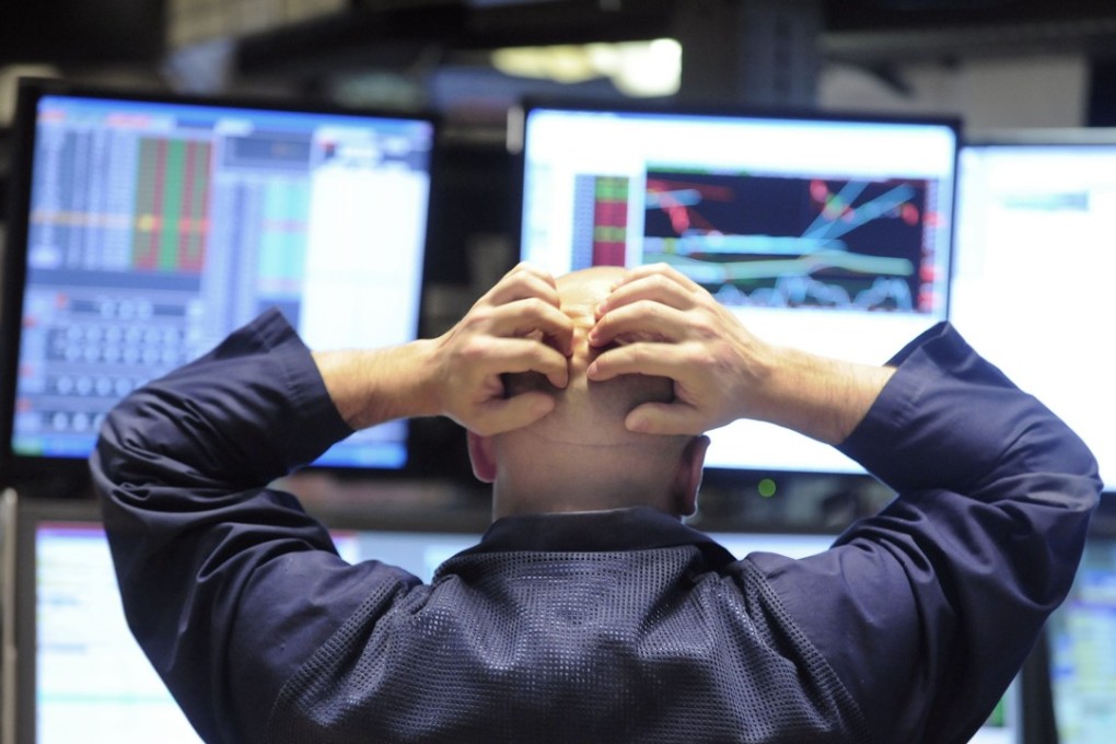 A specialist reacts to sharp losses on the floor of the New York Stock Exchange in October 2008, in the midst of the global financial crisis triggered by the bankruptcy of Lehman Brothers that September. Photo: AP