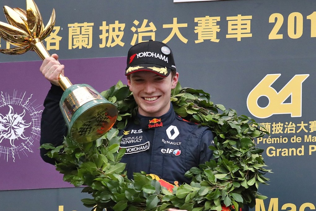Daniel Ticktum, of Motopark with VEB Volkswagen, celebrates his Macau Grand Prix victory on the podium. Photos: Nora Tam