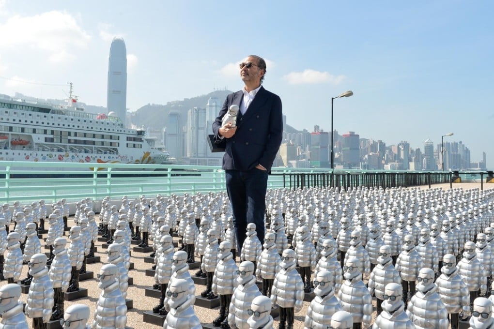Moncler CEO Remo Ruffini stands among an army of Mr. Moncler figurines that have been placed in groups around Hong Kong in conjunction with the opening of the Italian luxury brand’s new store in Tsim Sha Tsui.