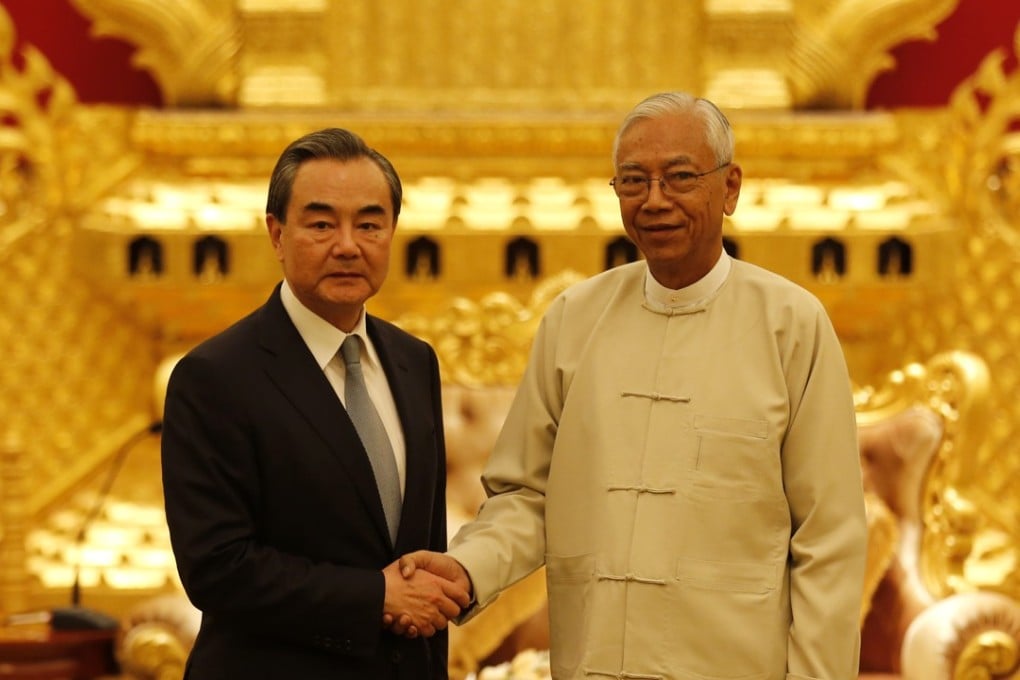 Myanmnese President U Htin Kyaw (right) greets Chinese Foreign Minister Wang Yi in Naypyidaw on Sunday. Photo: Xinhua