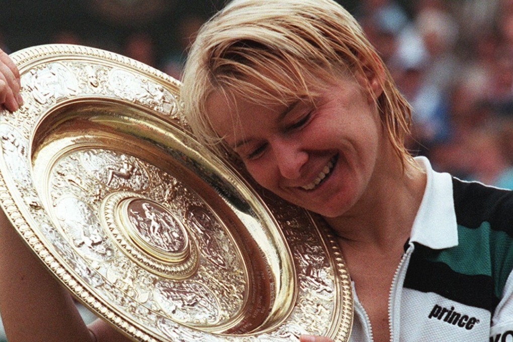 Jana Novotna savours her Wimbledon win in 1998. Photo: AFP