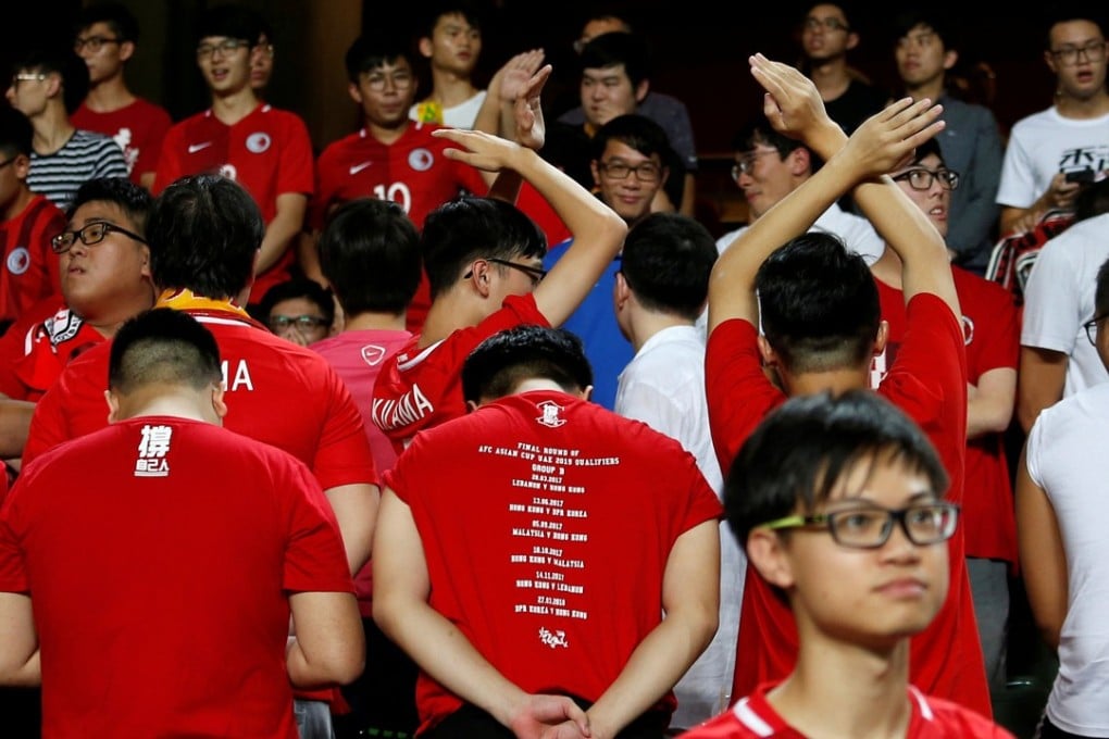 Hong Kong fans turn their backs during the Chinese national anthem, other fans booed, but the Chinese government could force the SAR to enact its laws on disrespecting the national anthem. Photo: Reuters