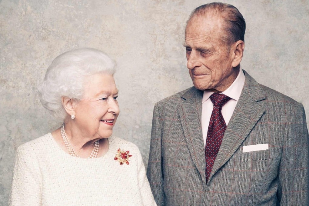 In this photograph released by Buckingham Palace on November 19, Britain's Queen Elizabeth II and her husband, Britain's Prince Philip, Duke of Edinburgh are pictured in the White Drawing Room at Windsor Castle, to mark their Platinum Wedding Anniversary, which falls on Monday. Photo: AFP / CAMERAPRESS / Matt Holyoak