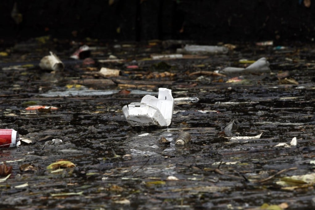 Garbage floats on the surface of a tributary in Newtown Creek, New York, in an area the size of 55 football fields designated by the US government as contaminated with hazardous substances and pollutants, in October 2012. Photo: AP