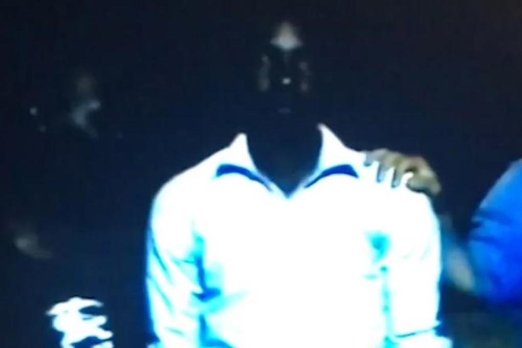 A man is put up for sale in an apparent slave auction, in a still image from a video obtained by CNN. Photo: CNN