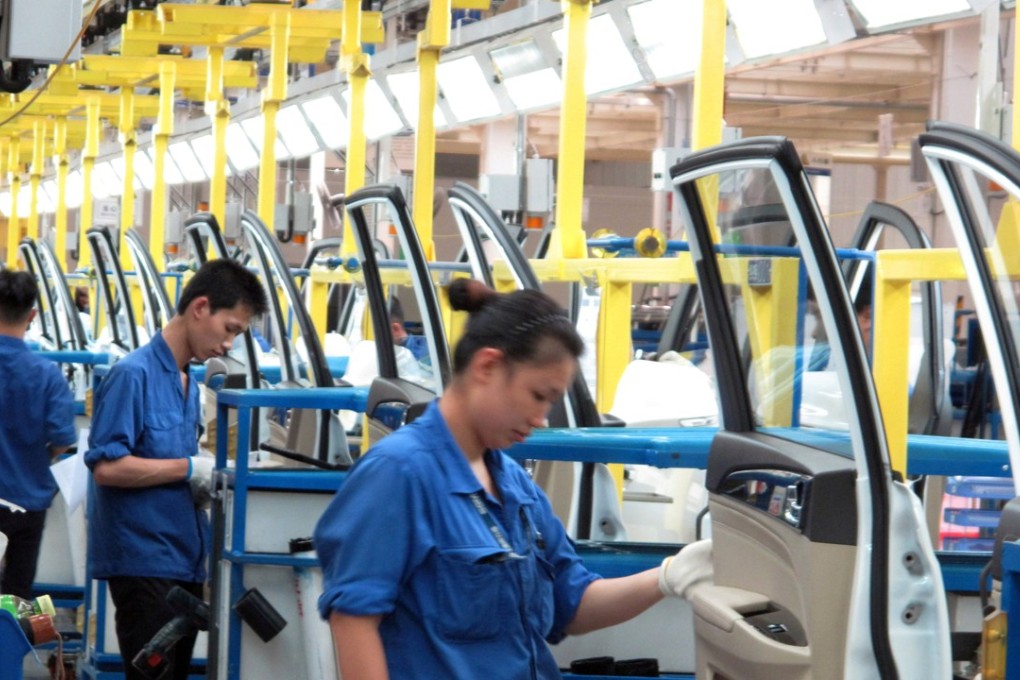 Employees work at a production line inside a factory of SIC-GM-Wuling in Liuzhou in Guangxi Zhuang autonomous region in June 2016. Photo: REUTERS