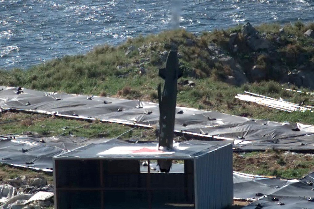 A Taurus missile fired from a South Korean air force F-15K fighter jet hits a target during a drill, off the country's western coast, South Korea. Photo: AP