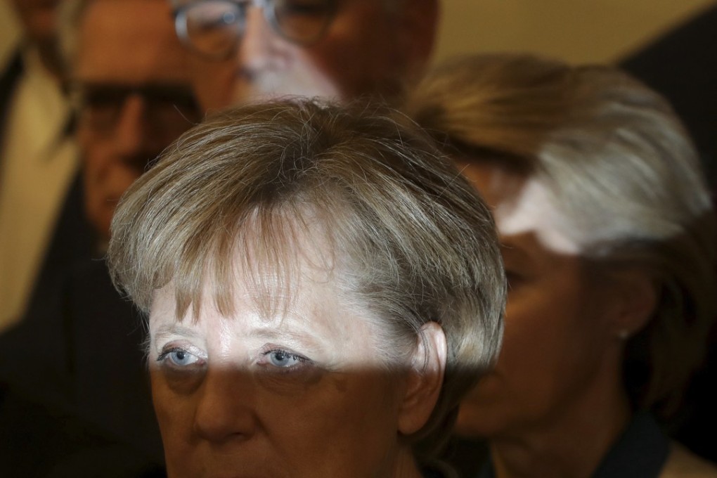 German Chancellor and chairwoman of the German Christian Democratic Union (CDU), Angela Merke attends a news conference about the results of exploratory talks on a coalition in Berlin, Germany on Monday. Photo: AP