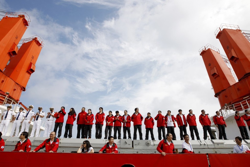 Members of the Chinese scientific expedition team line up on the icebreaker Xue Long as they return to Shanghai on October 10. The Xue Long (Snow Dragon) spent 83 days on the Arctic rim, completing its eighth Arctic expedition. Photo: Xinhua