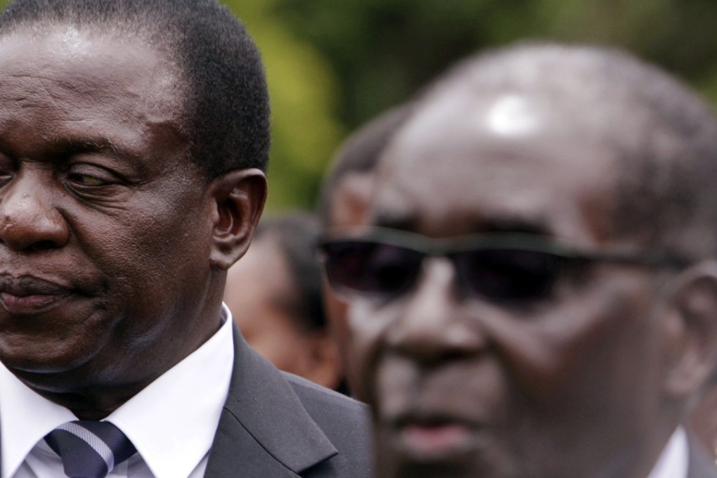 A file picture of Zimbabwe’s likely new president, Emmerson Mnangagwa (left) standing behind Robert Mugabe. Photo: Associated Press