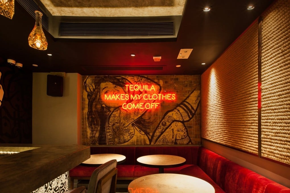 A neon sign lets you know what could happen if you have one too many drinks at Los Sotano in Lan Kwai Fong. Photo: Los Sotano