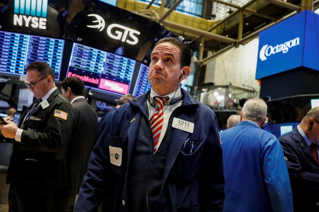 Traders at the New York Stock Exchange warily eye rallying stocks in market hitting record highs. Photo: Reuters