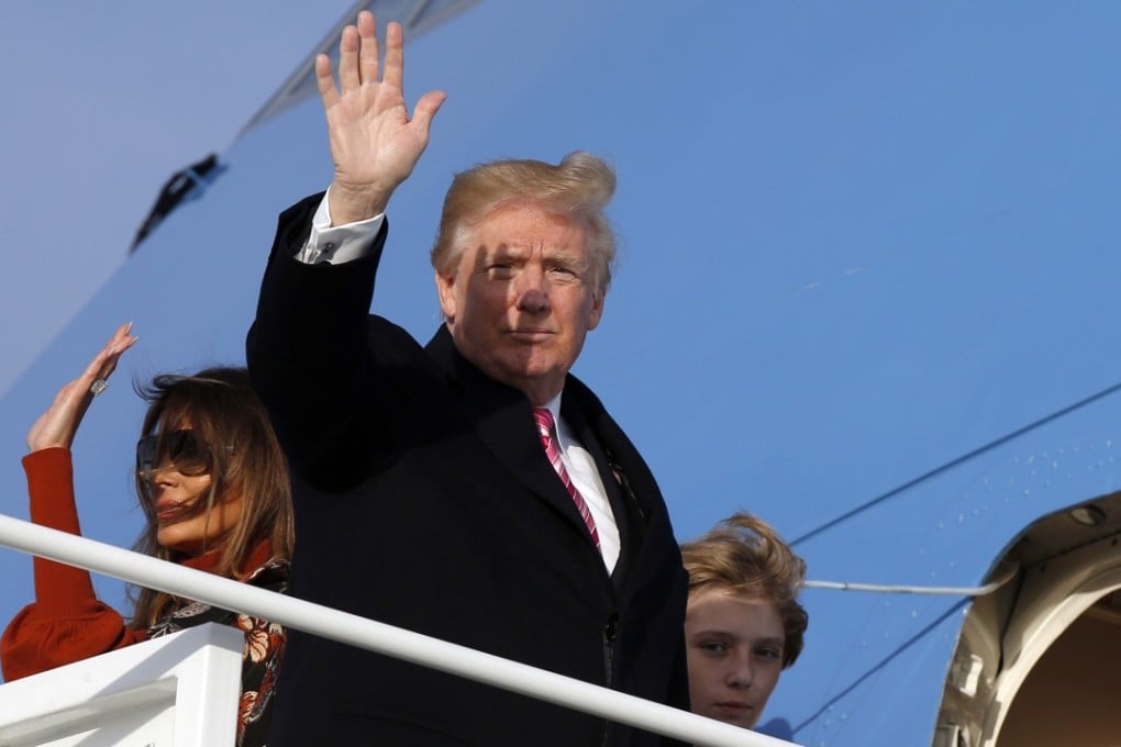 President Donald Trump waves as he boards Air Force One. His administration imposed new sanctions against North Korea. Photo: AP